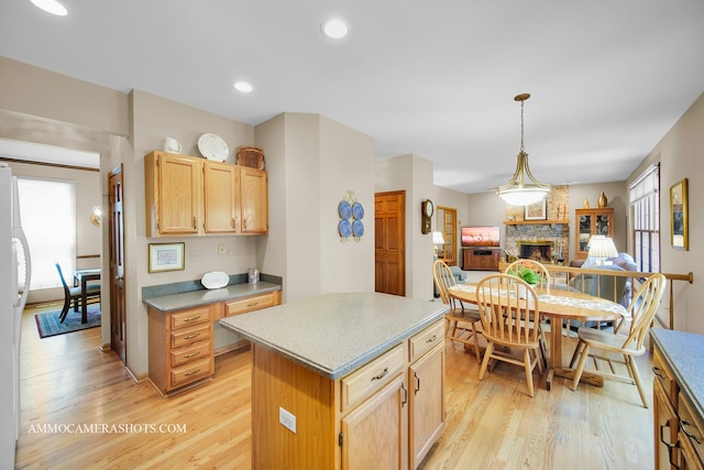400 Adare Dr, Cary, IL 60013 - kitchen featuring healthy amount of natural light, a fireplace, light wood-style floors, a center island, and recessed lighting