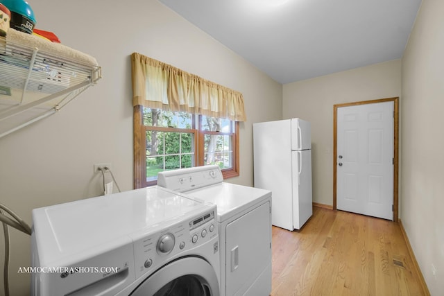 400 Adare Dr, Cary, IL 60013 - laundry area featuring washer and dryer and light wood-style flooring