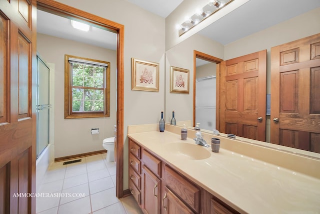 400 Adare Dr, Cary, IL 60013 - bathroom with vanity, tile patterned floors, and shower / bath combination with glass door
