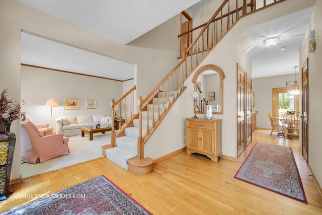 400 Adare Dr, Cary, IL 60013 - entryway with light wood-type flooring, stairway, and arched walkways