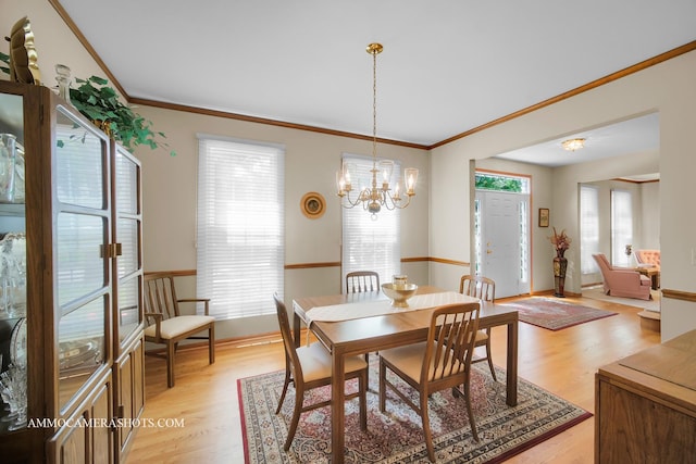 400 Adare Dr, Cary, IL 60013 - dining room with light wood finished floors, plenty of natural light, ornamental molding, and a chandelier