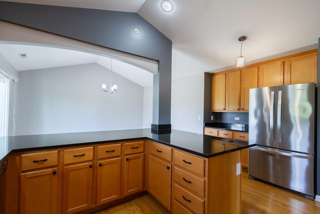 2746 Acorn Ct Unit 2746, West Dundee, IL 60118 - kitchen with freestanding refrigerator, lofted ceiling, dark countertops, light wood finished floors, and pendant lighting