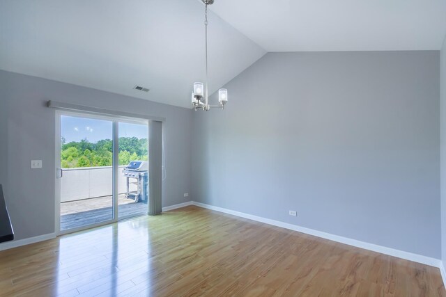 2746 Acorn Ct Unit 2746, West Dundee, IL 60118 - empty room featuring light wood-style floors, a chandelier, and vaulted ceiling