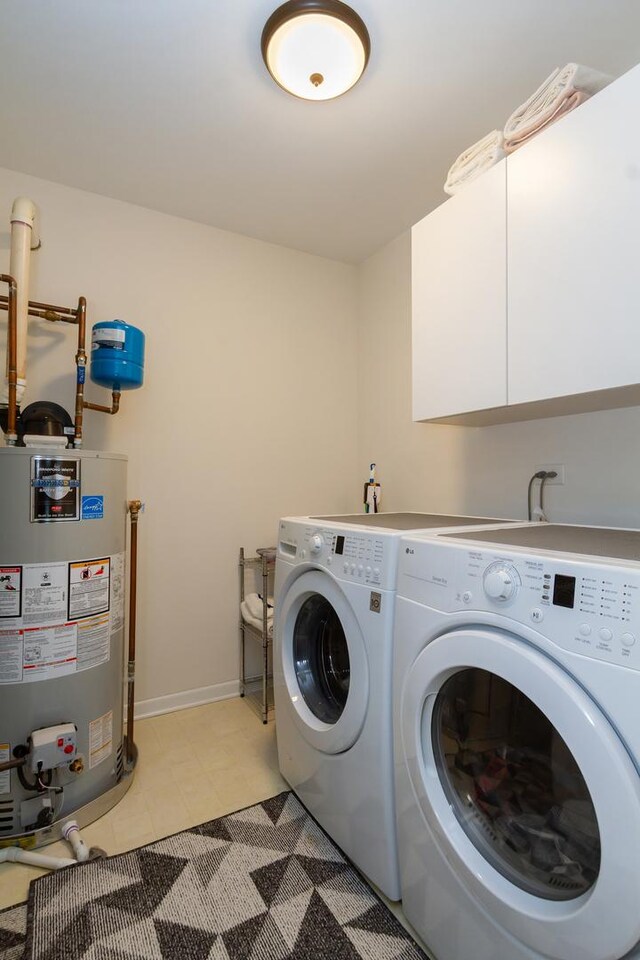 2746 Acorn Ct Unit 2746, West Dundee, IL 60118 - washroom featuring gas water heater, separate washer and dryer, and cabinet space