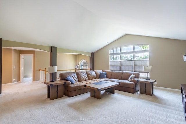 2746 Acorn Ct Unit 2746, West Dundee, IL 60118 - living area featuring arched walkways, lofted ceiling, and light carpet