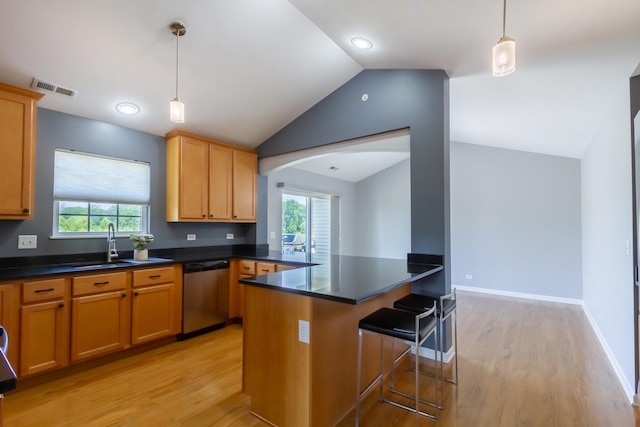 2746 Acorn Ct Unit 2746, West Dundee, IL 60118 - kitchen with stainless steel dishwasher, lofted ceiling, light wood-style flooring, dark countertops, and a peninsula