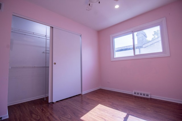 9135 Hollyberry Ave, Des Plaines, IL 60016 - unfurnished bedroom with wood finished floors, a closet, and recessed lighting