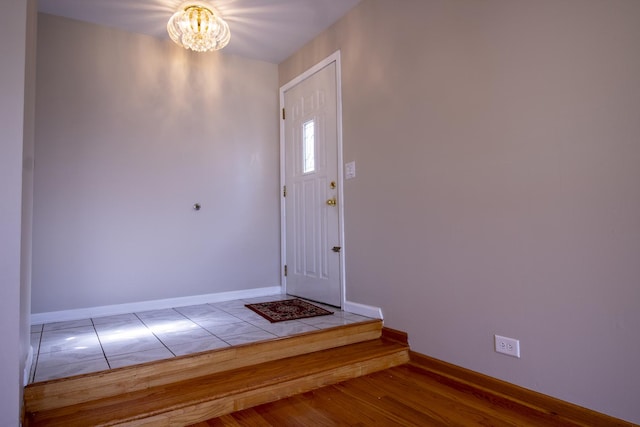 9135 Hollyberry Ave, Des Plaines, IL 60016 - foyer with a chandelier and baseboards