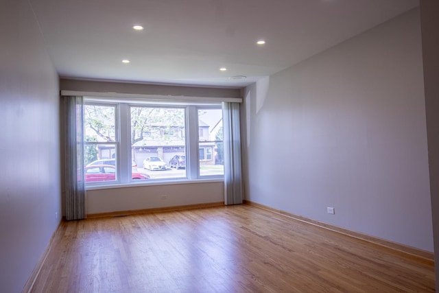 9135 Hollyberry Ave, Des Plaines, IL 60016 - unfurnished room featuring wood finished floors and recessed lighting