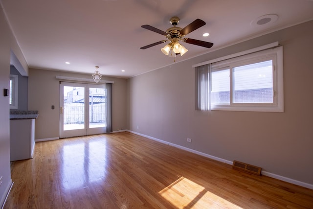 9135 Hollyberry Ave, Des Plaines, IL 60016 - unfurnished living room featuring a chandelier, wood finished floors, ceiling fan, and recessed lighting