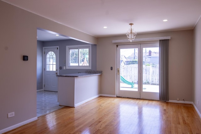 9135 Hollyberry Ave, Des Plaines, IL 60016 - unfurnished dining area featuring light wood finished floors, a chandelier, and recessed lighting