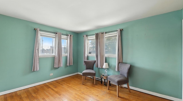 139 Hyde Park Ave, Bellwood, IL 60104 - sitting room with plenty of natural light and wood finished floors