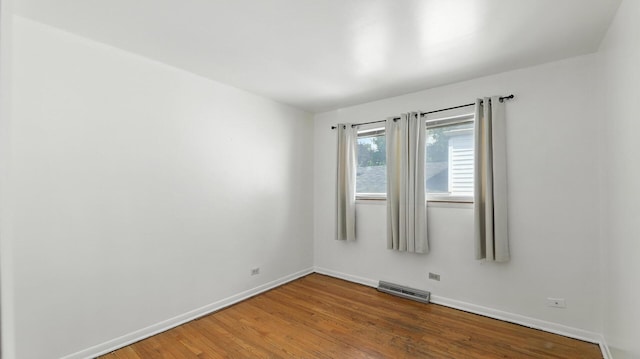 139 Hyde Park Ave, Bellwood, IL 60104 - unfurnished room featuring wood finished floors and baseboards