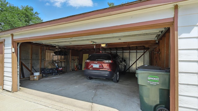139 Hyde Park Ave, Bellwood, IL 60104 - garage with a garage door opener and concrete driveway