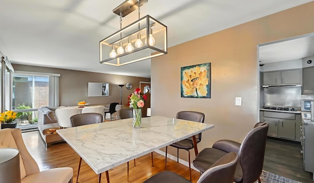 139 Hyde Park Ave, Bellwood, IL 60104 - dining space featuring dark wood-type flooring and a chandelier