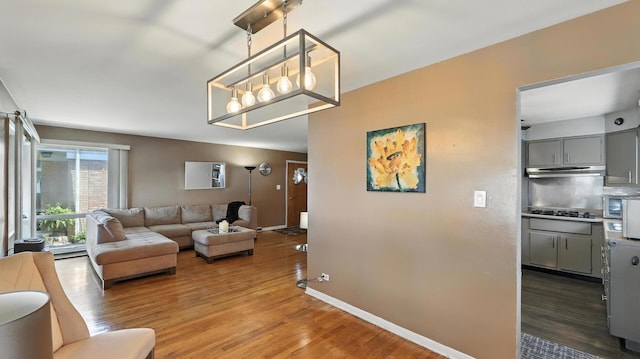 139 Hyde Park Ave, Bellwood, IL 60104 - living area featuring wood finished floors and a chandelier