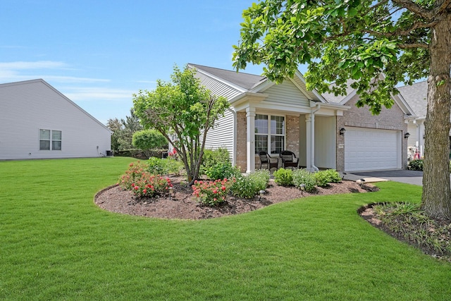 11837 Messiner Dr, Huntley, IL 60142 - view of front of house featuring a front lawn, a garage, driveway, and brick siding