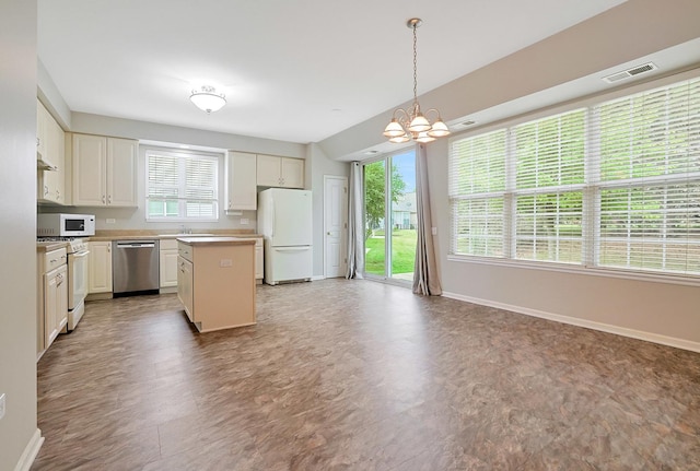 11837 Messiner Dr, Huntley, IL 60142 - kitchen with white appliances, a chandelier, a kitchen island, light countertops, and hanging light fixtures