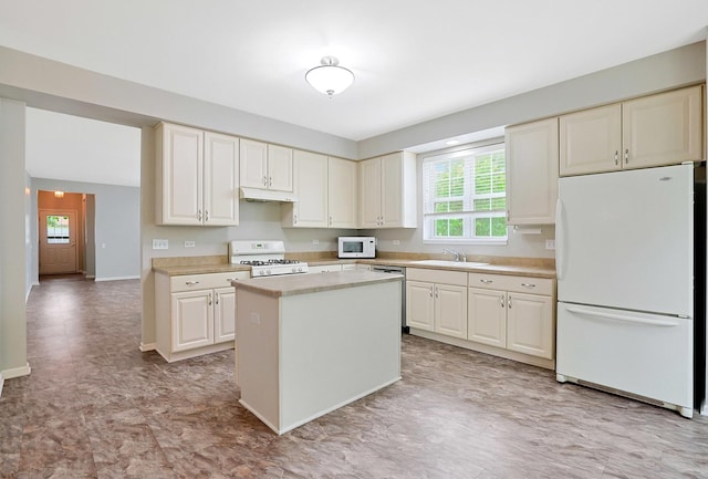 11837 Messiner Dr, Huntley, IL 60142 - kitchen featuring white appliances, under cabinet range hood, light countertops, and a center island