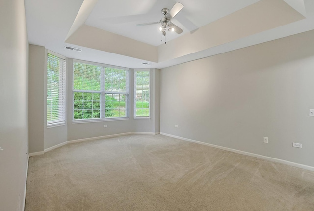 11837 Messiner Dr, Huntley, IL 60142 - unfurnished room featuring light colored carpet, a ceiling fan, and a raised ceiling