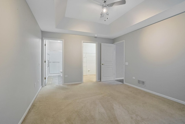 11837 Messiner Dr, Huntley, IL 60142 - unfurnished bedroom featuring ensuite bathroom, light carpet, and a tray ceiling