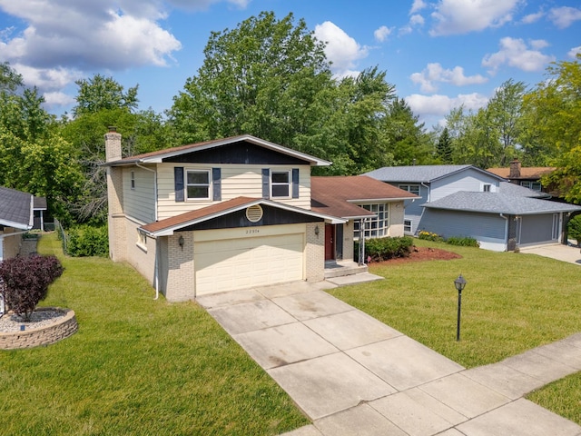 22904 Valley Dr, Richton Park, IL 60471 - tri-level home featuring brick siding, driveway, a chimney, a front yard, and an attached garage
