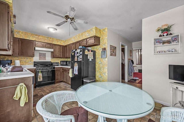 442 Kings Way, Mundelein, IL 60060 - kitchen featuring black appliances, under cabinet range hood, ceiling fan, light countertops, and decorative backsplash