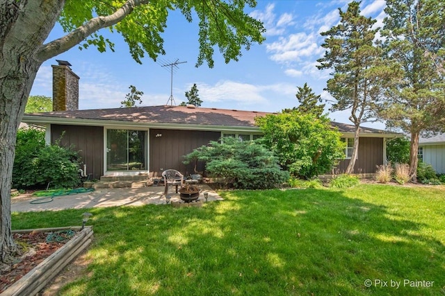 442 Kings Way, Mundelein, IL 60060 - back of house featuring a chimney, a yard, a patio area, and a fire pit