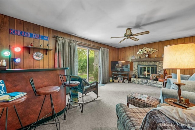 442 Kings Way, Mundelein, IL 60060 - carpeted living room with wood walls, a ceiling fan, and a fireplace