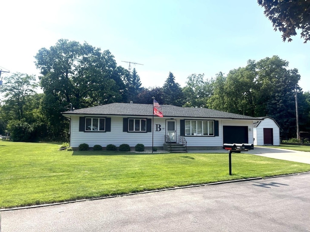 25458 W Knapp St, Channahon, IL 60410 - ranch-style home featuring concrete driveway, a garage, entry steps, and a front yard