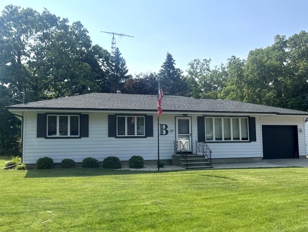 25458 W Knapp St, Channahon, IL 60410 - ranch-style house featuring a garage, a front yard, entry steps, and roof with shingles