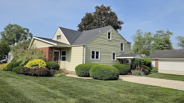 14357 Kenton Ave, Midlothian, IL 60445 - view of front facade featuring a front lawn and a shingled roof