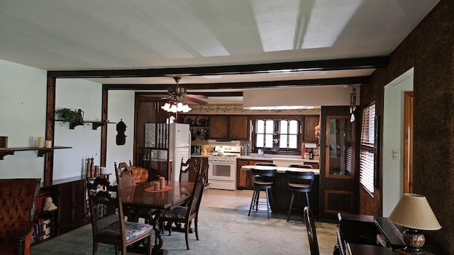 14357 Kenton Ave, Midlothian, IL 60445 - dining space featuring light carpet, a ceiling fan, and beamed ceiling