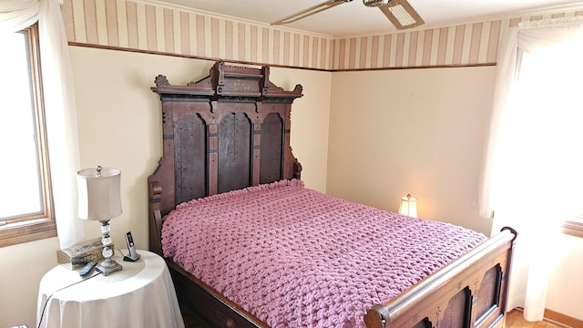 14357 Kenton Ave, Midlothian, IL 60445 - bedroom with wallpapered walls, ceiling fan, and crown molding