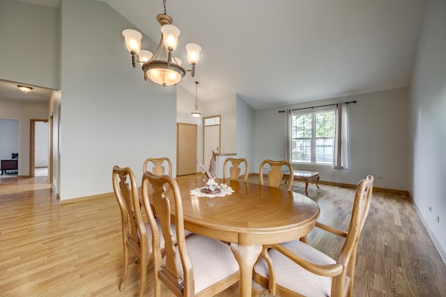 1478 W Flint Ln, Romeoville, IL 60446 - dining area with light wood finished floors, high vaulted ceiling, and a chandelier