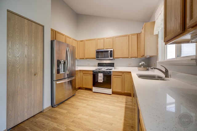 1478 W Flint Ln, Romeoville, IL 60446 - kitchen with stainless steel appliances, light brown cabinetry, light wood-style flooring, and high vaulted ceiling