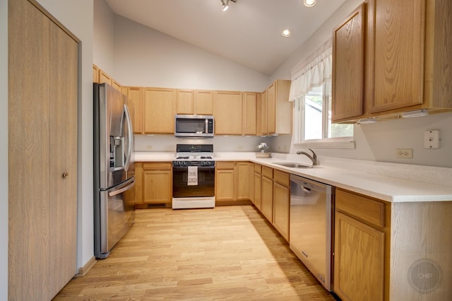 1478 W Flint Ln, Romeoville, IL 60446 - kitchen featuring appliances with stainless steel finishes, light brown cabinetry, light wood finished floors, lofted ceiling, and light countertops
