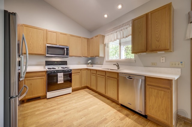 1478 W Flint Ln, Romeoville, IL 60446 - kitchen with appliances with stainless steel finishes, light brown cabinets, vaulted ceiling, light wood-style flooring, and light countertops