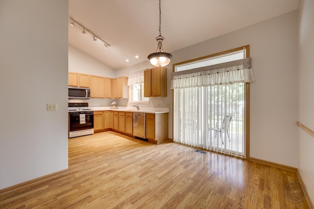1478 W Flint Ln, Romeoville, IL 60446 - kitchen with stainless steel appliances, light countertops, vaulted ceiling, light wood-style flooring, and hanging light fixtures