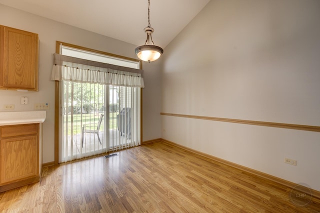 1478 W Flint Ln, Romeoville, IL 60446 - spare room with light wood-style floors and high vaulted ceiling