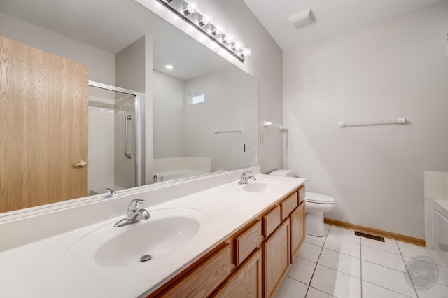 1478 W Flint Ln, Romeoville, IL 60446 - bathroom with a bath, double vanity, a shower stall, and tile patterned floors