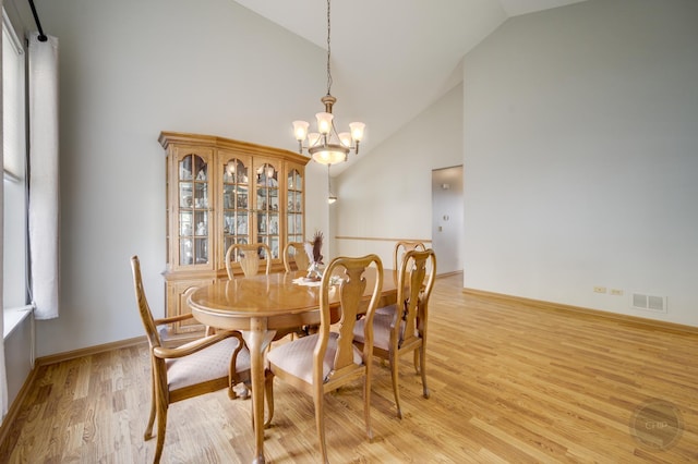 1478 W Flint Ln, Romeoville, IL 60446 - dining room with a chandelier, light wood-type flooring, and high vaulted ceiling