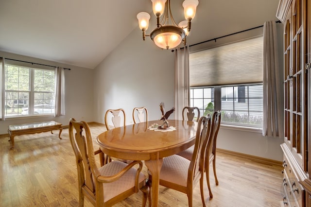 1478 W Flint Ln, Romeoville, IL 60446 - dining area featuring plenty of natural light, a chandelier, light wood finished floors, and vaulted ceiling