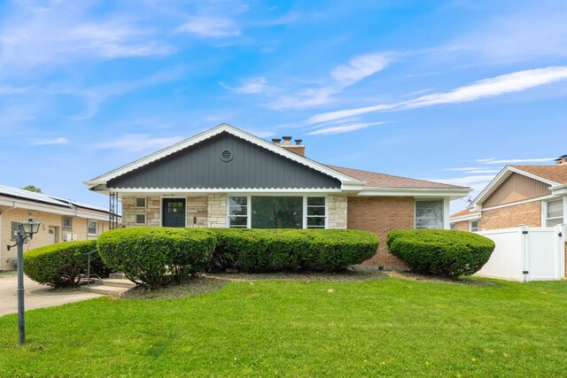 9210 S Mozart Ave, Evergreen Park, IL 60805 - view of front facade with a chimney and stone siding