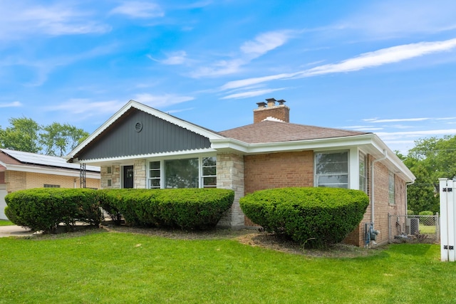 9210 S Mozart Ave, Evergreen Park, IL 60805 - view of home's exterior featuring a chimney, brick siding, and stone siding