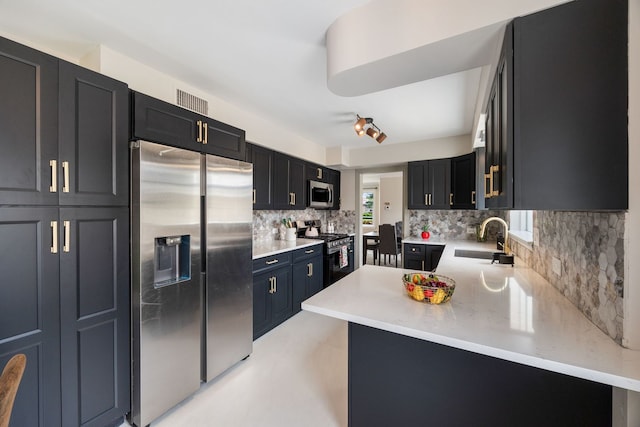 9210 S Mozart Ave, Evergreen Park, IL 60805 - kitchen featuring appliances with stainless steel finishes, tasteful backsplash, and dark cabinetry