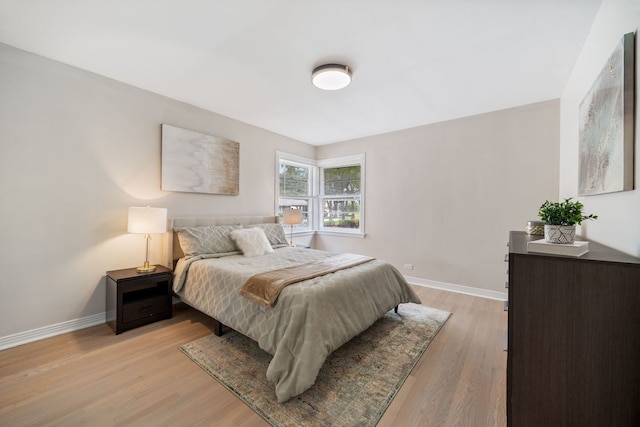 9210 S Mozart Ave, Evergreen Park, IL 60805 - bedroom with baseboards and light wood finished floors