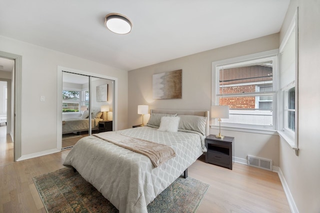 9210 S Mozart Ave, Evergreen Park, IL 60805 - bedroom with light wood finished floors and a closet