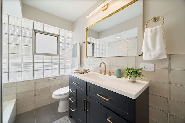 9210 S Mozart Ave, Evergreen Park, IL 60805 - full bathroom featuring tile walls, vanity, tile patterned flooring, and a tub to relax in