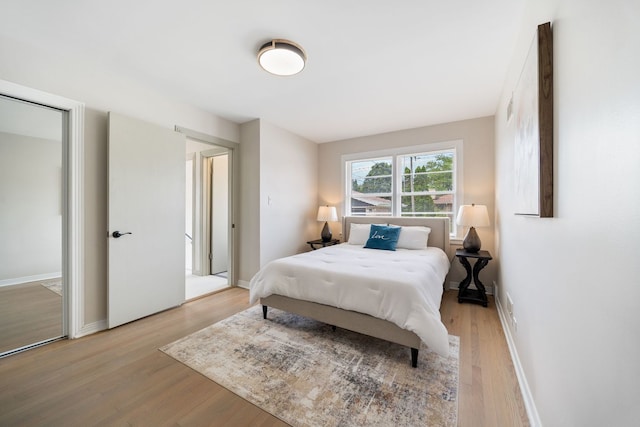 9210 S Mozart Ave, Evergreen Park, IL 60805 - bedroom with light wood-style floors and baseboards